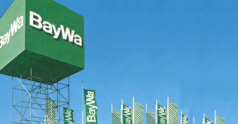 photo of a large green sign for BayWa featuring white helvetica