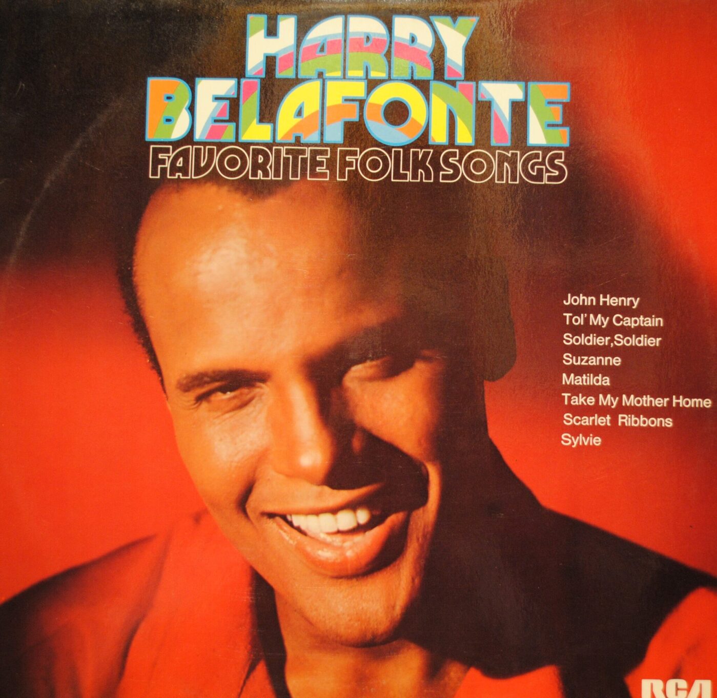 album cover with a smiling photo of harry belafonte superimposed with the title and a Helvetica tracklist on the right