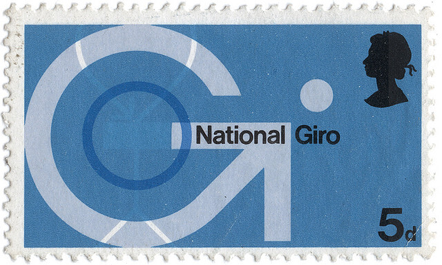 Vintage blue UK postage stamp with the Queen's silhouette and an arrow in the shape of a 'G' for 'Giro'.